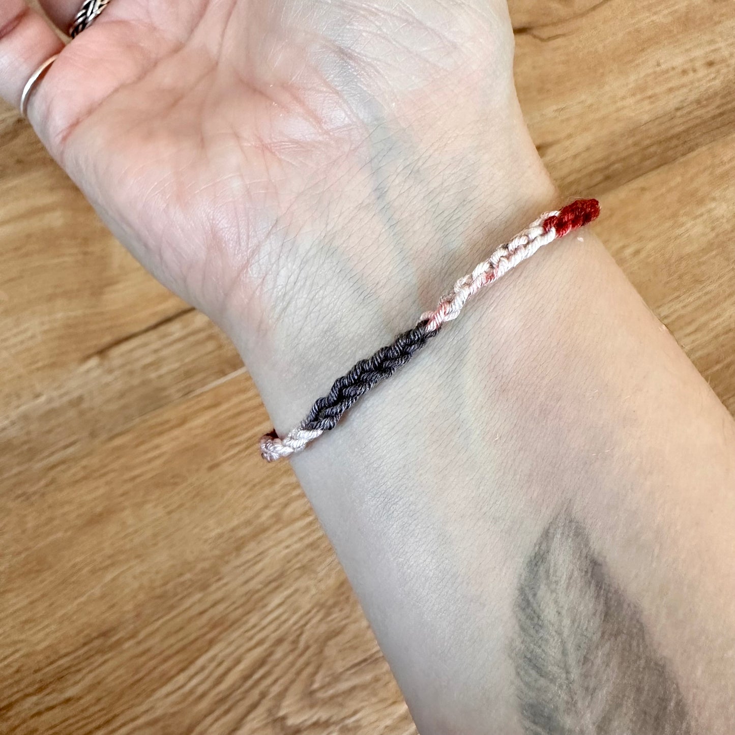 This is made with a stretchy elastic like yarn so it will fit just about any wrist.